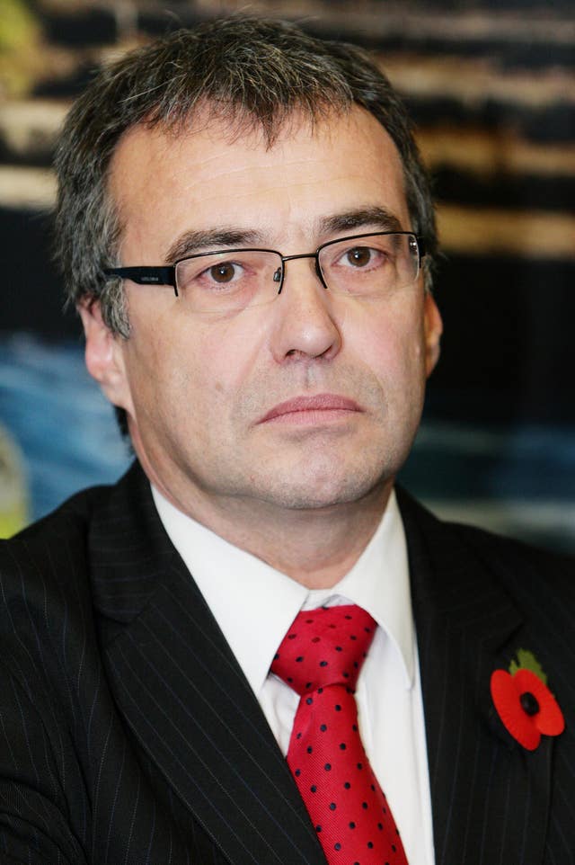 Headshot of Phil Woolas in suit and tiw