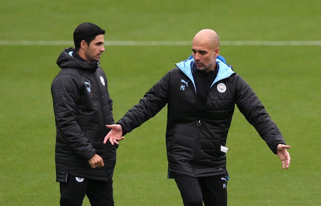 Arteta (left) has been working under Pep Guardiola since retiring from playing 