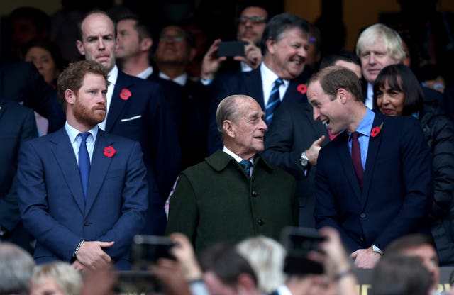 Harry, the Duke of Edinburgh and the Duke of Cambridge during the Rugby World Cup Final at Twickenham in London (David Davies/PA)