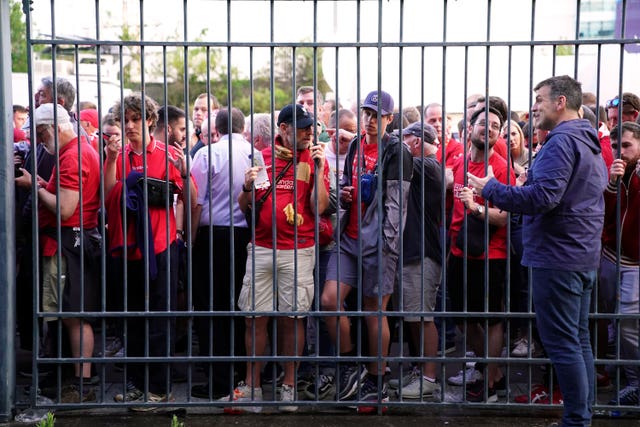 Fans gather outside the perimeter of the Stade de France on May 28