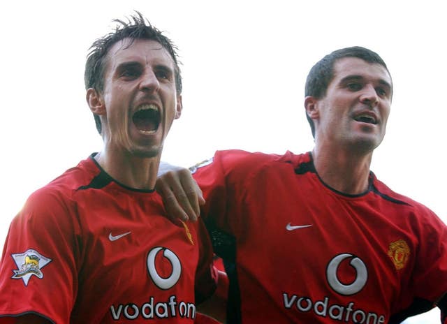 Roy Keane and Gary Neville in action for United (John Giles/PA)