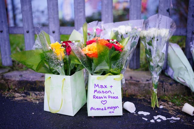 Floral tributes were left at the scene to the teenagers (Ben Birchall/PA)