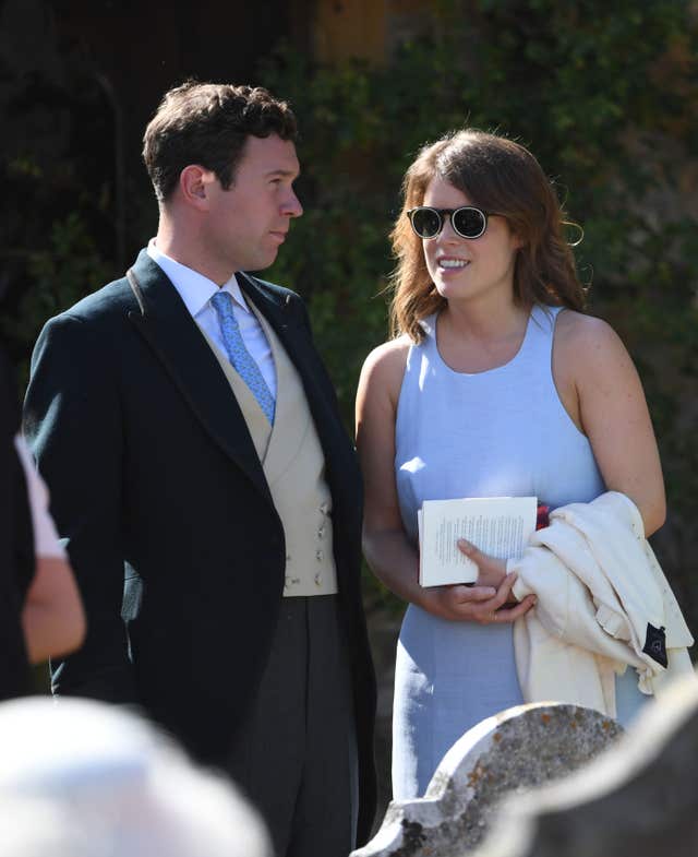 Princess Eugenie and her fiance Jack Brooksbank outside St Mary the Virgin Church in Frensham, Surrey, after attending the wedding of Charlie van Straubenzee and Daisy Jenk