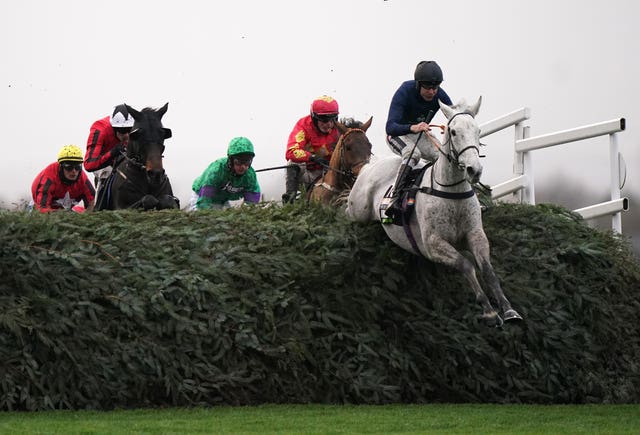 Snow Leopardess powers over the National fences in the Becher Chase