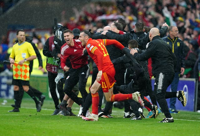 Gareth Bale celebrates after Wales qualified for the World Cup (David Davies/PA)