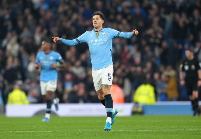 John Stones celebrates scoring Manchester City's equaliser against Arsenal 