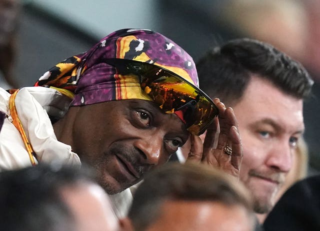 Swansea City co-owner Snoop Dogg supporting his team from the stands