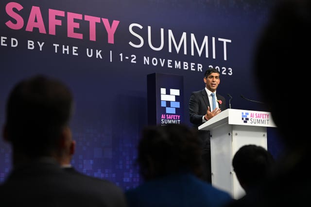 Rishi Sunak delivers a speech at the AI Safety Summit in 2023.