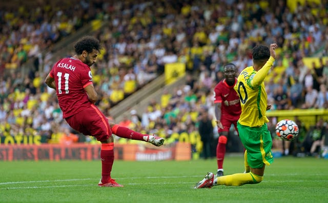 Salah (left) scored Liverpool's third goal when they opened their Premier League campaign with a 3-0 win at Norwich on August 14 (Joe Giddens/PA).