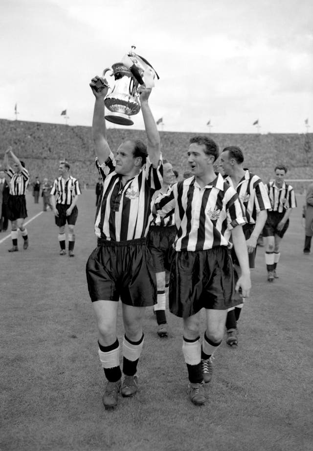 Newcastle captain James Scoular celebrates victory over Manchester City in the 1955 FA Cup final