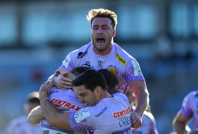 Exeter celebrate their fourth try against Toulouse