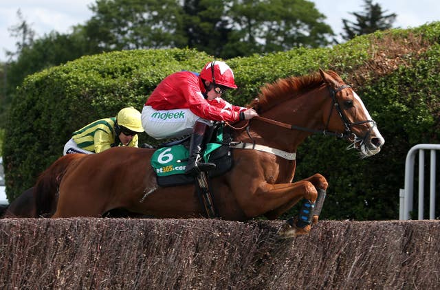 Jamie Moore aboard Sire De Grugy at Sandown in 2014 