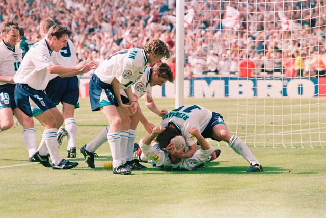 Paul Gascoigne is swamped by England team-mates after his wonder goal against Scotland at Euro 96