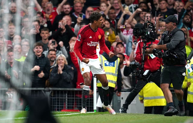 Raphael Varane celebrates the winner