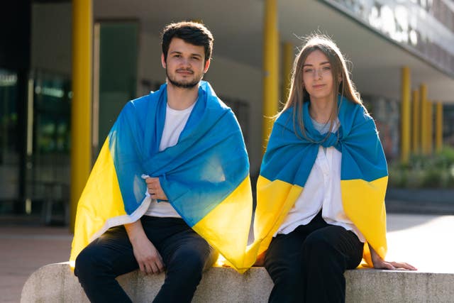 Two students wear Ukrainian flags