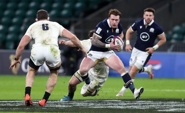 Scotland’s Stuart Hogg  breaks past England’s Mark Wilson