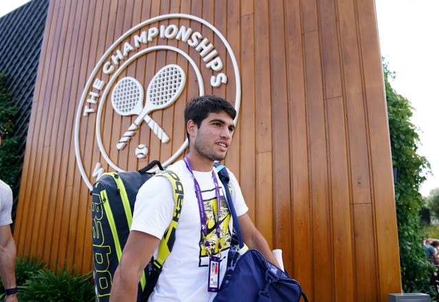 Carlos Alcaraz arrives for practice at Wimbledon