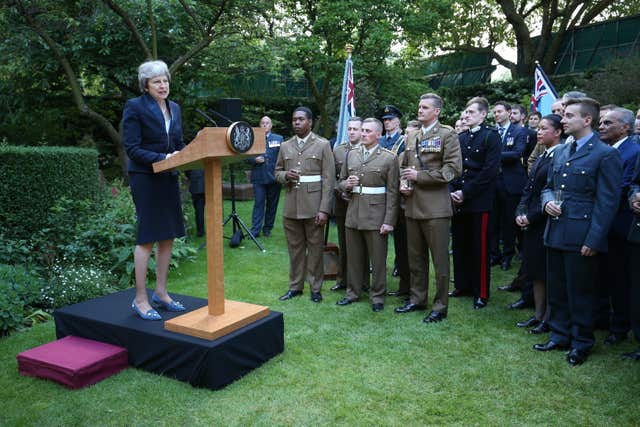 Prime Minister Theresa May speaks to personnel from the Army, Navy and RAF (Jonathan Brady/PA)