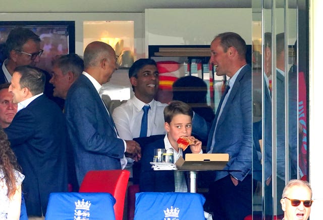 The Prince of Wales chatted to Prime Minister Rishi Sunak while Prince George  enjoyed a slice of pizza at the cricket (PA)