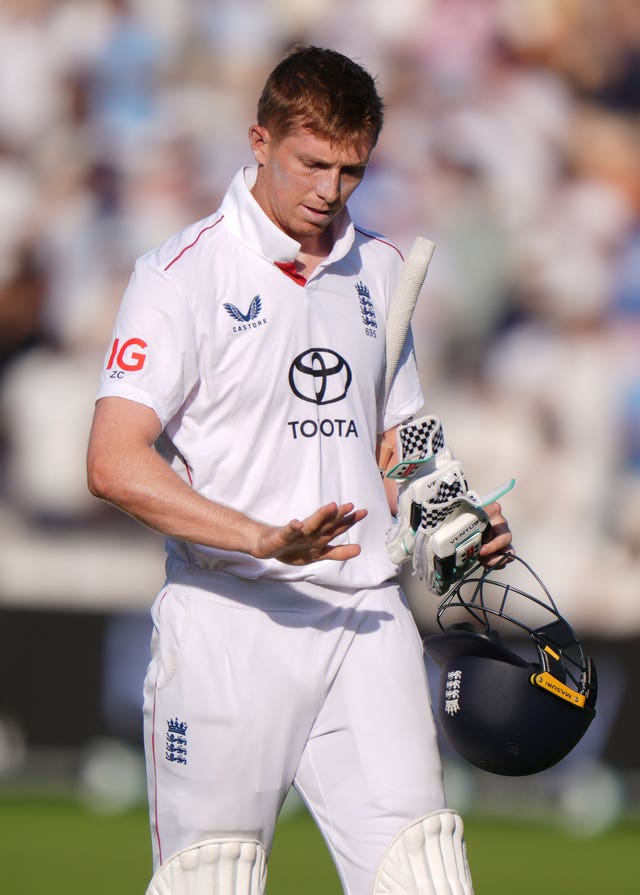 England’s Zak Crawley inspects his finger as he leaves the field
