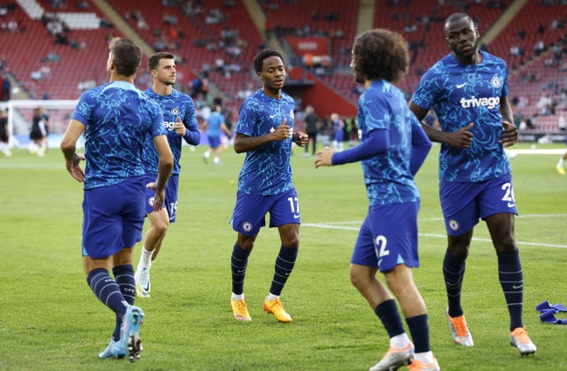Raheem Sterling, centre, Marc Cucurella, second right, and Kalidou Koulibaly, right, warm up for Chelsea