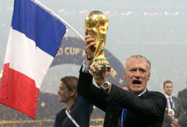 Didier Deschamps poses with the trophy after his France team won the World Cup final in Russia in 2018 (Owen Humphries/PA)