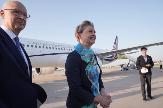 Yvette Cooper meets the UK Ambassador to China on the tarmac