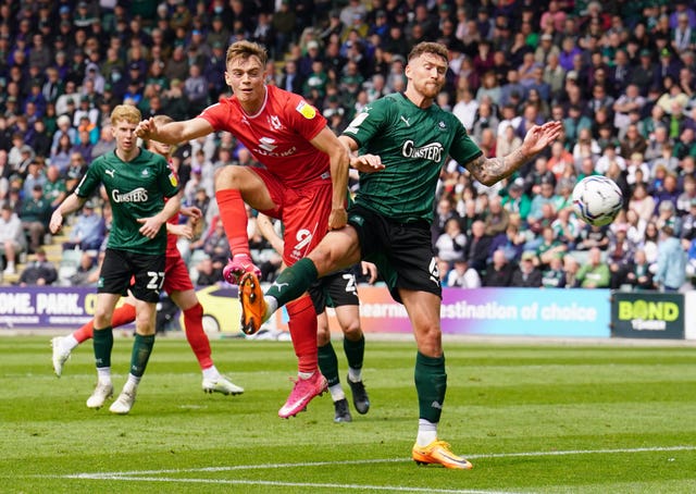 Plymouth Argyle's Joe Edwards challenges for a ball