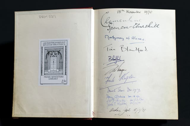 The signatures of the Churchill family are seen in one of three Downing Street Visitors Books at the National Archives 