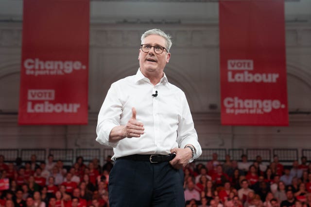 Labour leader Sir Keir Starmer addresses an audience of Labour Party members and supporters during a rally at the Royal Horticultural Halls in central London