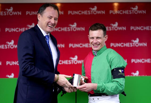 Paul Townend (right) is handed his award by Charlie McConalogue 