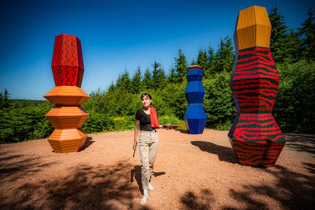 Artist Alicja Biala with her Totems artwork, which symbolises the relationship between humans and the forces of nature (Ben Birchall/PA)