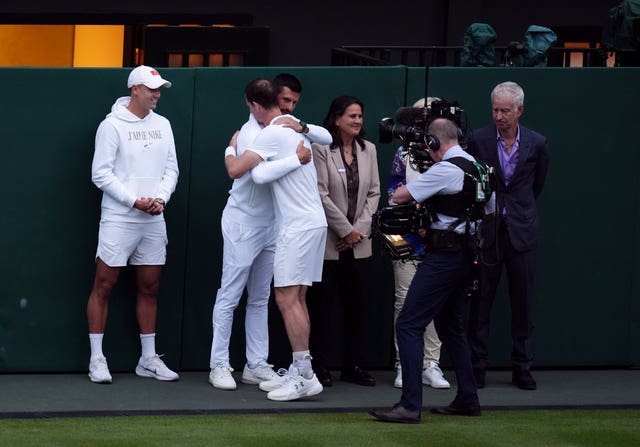 Novak Djokovic and Andy Murray hug at the latter's Wimbledon farewell