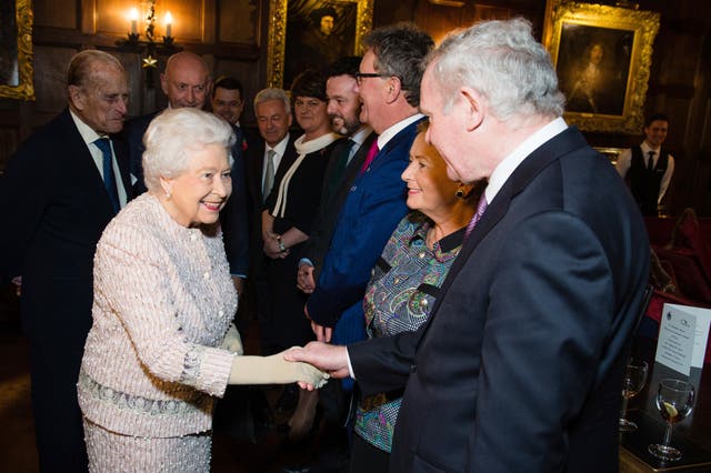 The Duke of Edinburgh (left), the Queen and Martin McGuinness (right) at a Co-operation Ireland reception at Crosby Hall in London (Jeff Spicer/PA)