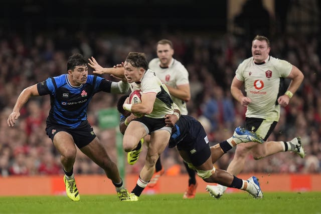 Japan’s Dylan Riley (left) and Wales’ Dan Edwards (second from left) battle for the ball 