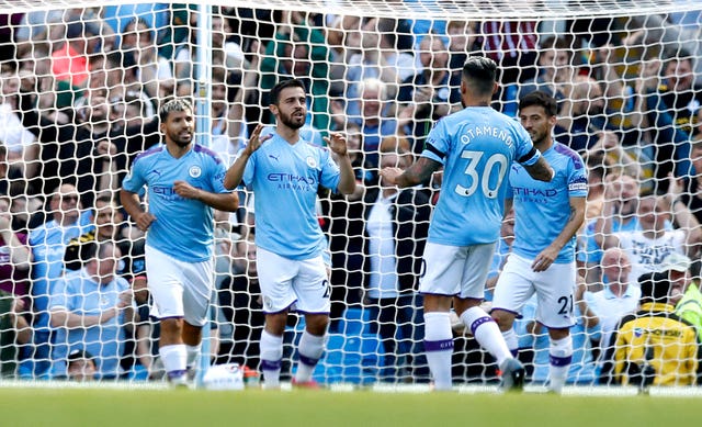 Manchester City’s Bernardo Silva, second left, celebrates with fellow goalscorers Sergio Aguero, Nicolas Otamendi and David Silva, l-r, against Watford in 2019
