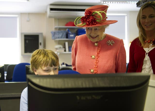 Jubilee Queen: The monarch's fashion staples, wardrobe tricks and style choices 5 Queen visits school