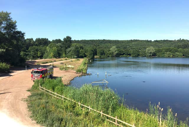 Police divers search lake for 13-year-old boy