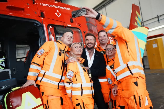 David Beckham posing for a selfie with members of the Air Ambulance crew