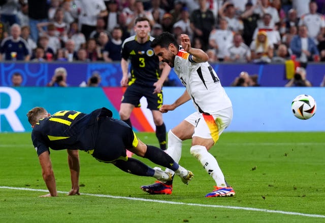 Scotland’s Ryan Porteous fouls Germany’s Ilkay Gundogan