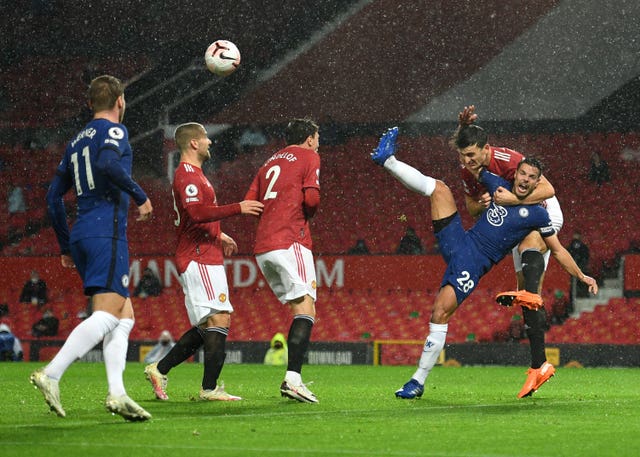 Cesar Azpilicueta goes down in the box as Manchester United’s Harry Maguire clears the ball