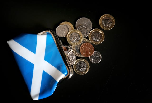 Coins spilling out of a Saltire purse