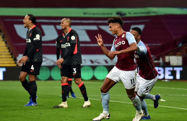 Ollie Watkins, second right, celebrates his hat-trick against Liverpool