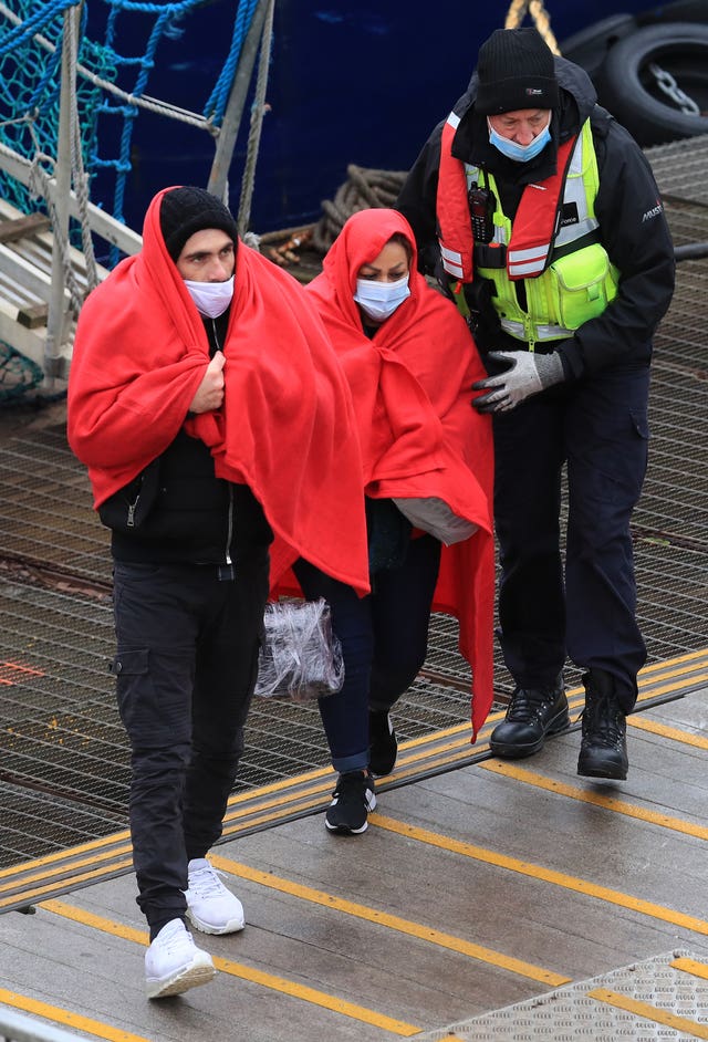 Migrants being taken into Dover