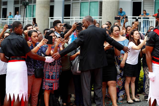 Crowds await the visit of the Duke and Duchess of Sussex to the University of the South Pacific