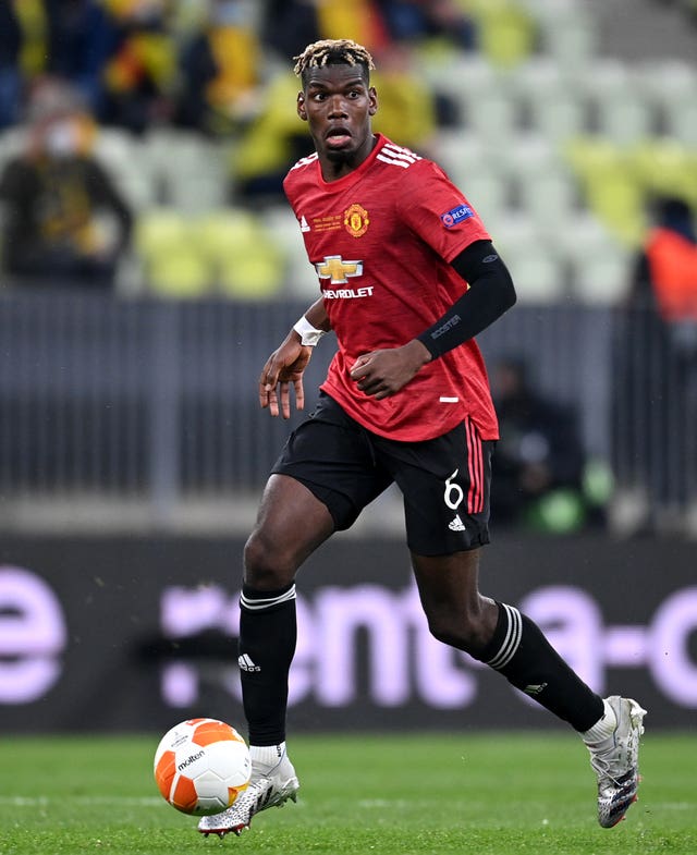 Paul Pogba takes the ball forward with his right foot