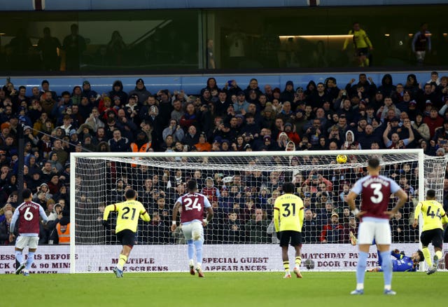 Douglas Luiz, left, scores Aston Villa’s late winner from the penalty spot