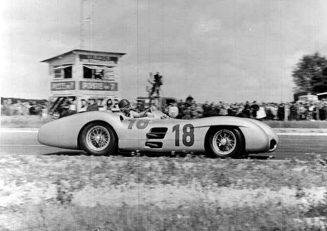 Juan Manuel Fangio in his Mercedes car on the way to winning the 1954 French Grand Prix