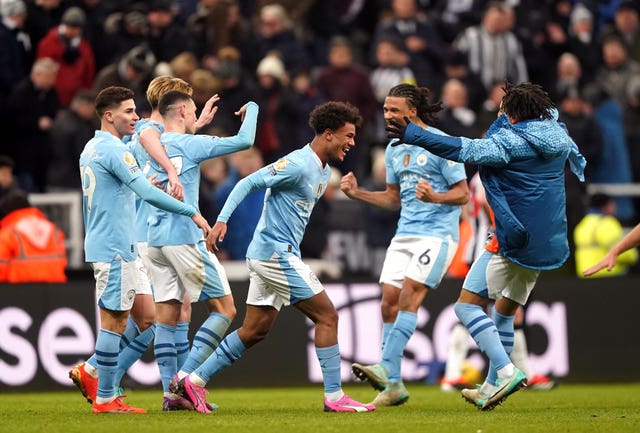 Manchester City’s Oscar Bobb (centre) celebrates scoring