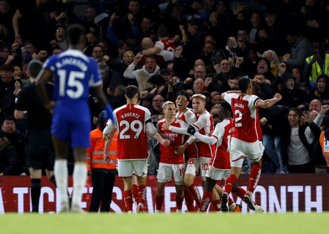 Arsenal’s Leandro Trossard (centre) celebrates with his team-mates after scoring at Chelsea